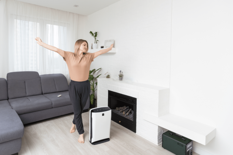 Woman stretching in living room in front of portable AC unit